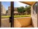 A view from a balcony looking out at the exterior of the building and the courtyard landscape at 2228 N 52Nd St # 117, Phoenix, AZ 85008