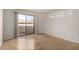 Bedroom featuring large sliding glass doors to a balcony and tile floors at 2228 N 52Nd St # 117, Phoenix, AZ 85008