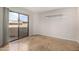 Bedroom featuring large sliding glass doors to a balcony and tile floors at 2228 N 52Nd St # 117, Phoenix, AZ 85008