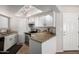 Well-lit kitchen features granite countertops and white cabinetry at 2228 N 52Nd St # 117, Phoenix, AZ 85008