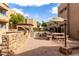 Outdoor grill and seating area with tables, benches, shade, and brick pavers at 2228 N 52Nd St # 117, Phoenix, AZ 85008