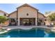 Backyard featuring a large patio, comfortable seating, barbecue grill, and a beautiful pool at 2450 E Glass Ln, Phoenix, AZ 85042