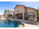 Backyard featuring pool, patio area with comfortable seating, and a well-maintained outdoor space at 2450 E Glass Ln, Phoenix, AZ 85042