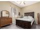 Cozy bedroom featuring neutral tones, carpeted floors, and a dresser at 2450 E Glass Ln, Phoenix, AZ 85042