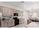 Bright kitchen featuring stainless steel appliances, plentiful cabinets and adjacent breakfast nook at 2450 E Glass Ln, Phoenix, AZ 85042