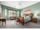 Spacious main bedroom with a bay window, lots of light, and green accent walls at 2450 E Glass Ln, Phoenix, AZ 85042