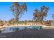 Beautiful backyard pool overlooks a lush golf course, perfect for relaxing and entertaining at 2450 E Glass Ln, Phoenix, AZ 85042