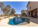 Backyard pool with adjacent patio and seating offering a private outdoor oasis at 2450 E Glass Ln, Phoenix, AZ 85042