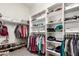 Well-organized walk-in closet providing ample storage with shelves and racks at 2450 E Glass Ln, Phoenix, AZ 85042