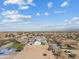 This community has beautiful homes with lush yards and community basketball and play areas under a bright blue sky at 2457 W Phillips Rd, Queen Creek, AZ 85144