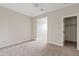 Neutral bedroom offering access to a walk-in closet at 2457 W Phillips Rd, Queen Creek, AZ 85144