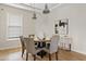 Bright dining room featuring a round table with seating for four and stylish overhead lighting at 2457 W Phillips Rd, Queen Creek, AZ 85144