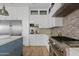 Modern kitchen featuring stainless steel appliances, granite countertops, and a central island at 2457 W Phillips Rd, Queen Creek, AZ 85144