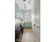 Modern laundry room with sleek cabinetry, ample counter space, and state-of-the-art washer and dryer units at 2457 W Phillips Rd, Queen Creek, AZ 85144