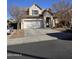 Charming two-story home featuring a two-car garage and stone entryway, complemented by desert landscaping at 2730 E Vermont Dr, Gilbert, AZ 85295