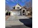 Charming two-story home featuring a two-car garage and stone entryway, complemented by desert landscaping at 2730 E Vermont Dr, Gilbert, AZ 85295