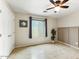 Bright bedroom featuring a ceiling fan, neutral paint, and a tiled floor for a clean and modern aesthetic at 2923 N 63Rd St, Mesa, AZ 85215