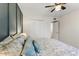 Cozy bedroom featuring a blue accent wall, soft lighting, and closet space for personal storage at 2923 N 63Rd St, Mesa, AZ 85215