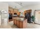 Spacious kitchen with stainless steel appliances, an island with a granite countertop, and lots of cabinet space at 2923 N 63Rd St, Mesa, AZ 85215