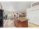 Bright kitchen featuring a center island with granite counters, wood cabinets, and nearby breakfast nook at 2923 N 63Rd St, Mesa, AZ 85215