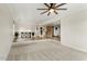 Spacious living room with carpet, neutral walls, and tile floors leading to other rooms at 2923 N 63Rd St, Mesa, AZ 85215