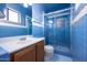 Charming bathroom with blue tile, shower, toilet, and vanity at 2928 W Cactus Rd, Phoenix, AZ 85029