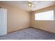 Bright bedroom featuring carpet, natural light, and neutral walls at 2928 W Cactus Rd, Phoenix, AZ 85029