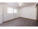 Bright bedroom features neutral walls, plush carpet, and mirrored closet at 2928 W Cactus Rd, Phoenix, AZ 85029