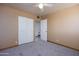 Bedroom featuring neutral walls, soft carpet, and closet for ample storage at 2928 W Cactus Rd, Phoenix, AZ 85029