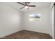 This bedroom features wood floors, a ceiling fan, and a bright window at 3027 S Clementine Dr, Tempe, AZ 85282