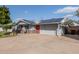 Cozy single-story home with solar panels, carport, red door, and well-maintained landscaping at 3027 S Clementine Dr, Tempe, AZ 85282