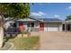 Charming single Gathering home featuring solar panels, a well-manicured lawn, and a two-car garage at 3027 S Clementine Dr, Tempe, AZ 85282