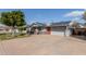 Single Gathering home with solar panels, a front lawn with greenery, and a covered parking area at 3027 S Clementine Dr, Tempe, AZ 85282