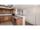 Well-lit kitchen featuring granite countertops, wood cabinets, and stainless steel appliances at 3027 S Clementine Dr, Tempe, AZ 85282