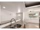 Modern kitchen with stainless steel sink, granite countertops, and bar-style seating at 3027 S Clementine Dr, Tempe, AZ 85282