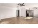 Spacious living area featuring tile flooring, neutral paint, and views of the kitchen area at 3027 S Clementine Dr, Tempe, AZ 85282