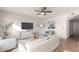 Bright living room featuring a neutral color palette, modern furnishings, and a ceiling fan at 3027 S Clementine Dr, Tempe, AZ 85282