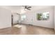 Bright living room with tile flooring, neutral walls, multiple windows, and ceiling fans at 3027 S Clementine Dr, Tempe, AZ 85282