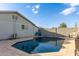 Backyard pool with blue water, gray exterior walls, and limited landscaping at 3027 S Clementine Dr, Tempe, AZ 85282