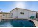 Backyard pool featuring blue water, gray exterior walls, and limited landscaping at 3027 S Clementine Dr, Tempe, AZ 85282