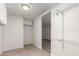 Walk-in closet features white wire shelving, a storage cabinet and an entry to the living space at 3027 S Clementine Dr, Tempe, AZ 85282