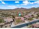 Stunning home aerial view featuring lush landscaping and a mountain vista at 32754 N 15Th Gln, Phoenix, AZ 85085