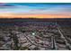 Aerial view of Primary-planned community in the desert at sunset at 32754 N 15Th Gln, Phoenix, AZ 85085