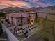 Aerial view of a luxurious backyard with fire pit, seating area and desert landscaping at 32754 N 15Th Gln, Phoenix, AZ 85085