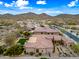 Aerial view of a desert home with a manicured backyard, pool, and mountain views at 32754 N 15Th Gln, Phoenix, AZ 85085