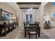 Formal dining room with an elegant chandelier, console table, and decorative mirror at 32754 N 15Th Gln, Phoenix, AZ 85085