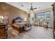 Serene main bedroom with a king-size bed, accent wall, and tranquil sitting area at 32754 N 15Th Gln, Phoenix, AZ 85085