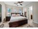 This main bedroom features a bed, a ceiling fan, and two windows at 32754 N 15Th Gln, Phoenix, AZ 85085