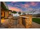 Outdoor kitchen with built-in grill and stainless steel refrigerator at 32754 N 15Th Gln, Phoenix, AZ 85085