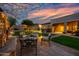 Inviting outdoor patio with comfortable seating and sunset sky at 32754 N 15Th Gln, Phoenix, AZ 85085